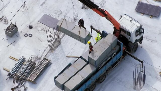 Worker was injured after falling from small truck crane at the construction site