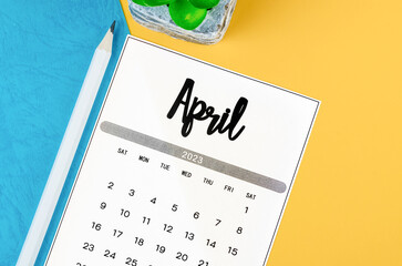 The April 2023 Monthly calendar for 2023 year with pencil on beautiful background.