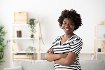 Fototapeta na wymiar Portrait of young black woman at home