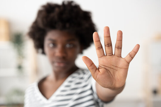 Closeup of african woman's hand making stop sign