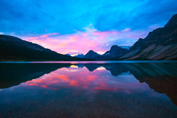 Fototapeta na wymiar Pink Sunrise Over Mountain Calm Lake