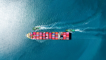top view Cargo Container Ship with Tug boat carrying container and running very fast for export...