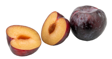 Naklejka na ściany i meble Black plums, one whole and one cut in half.