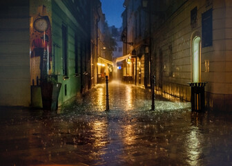 fairy tale cityscape under heavy rain on the stone pavement in old town at night