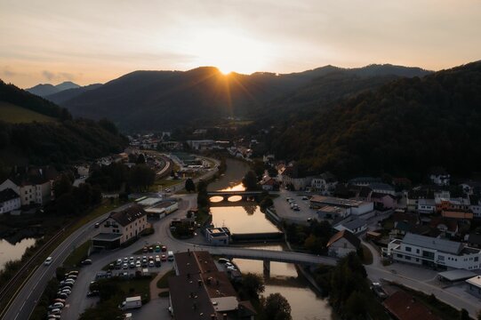 Aerial drone view of the townscape of Lilienfeld and the Traisen River during the sunset
