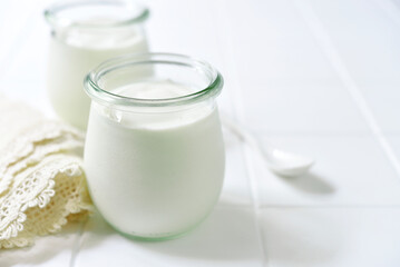 Natural organic yogurt in a vintage glass jar.