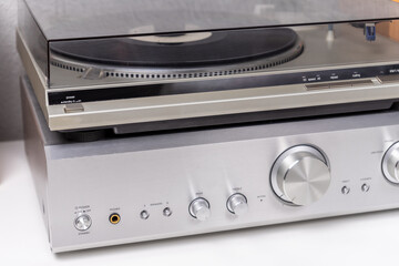 Fototapeta premium cropped view of vintage vinyl player and amplifier