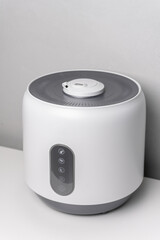 white and grey humidifier on the table