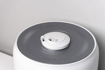 white and grey humidifier on the table