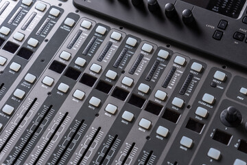 closeup view of professional audio digital mixing sound console