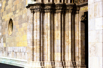 beautiful carved layered stone church door frame. richly decorated stone posts with ornate...