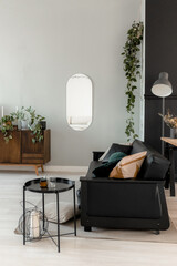 Black leather sofa in the interior