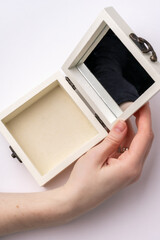 Open jewelry box with mirror on white background