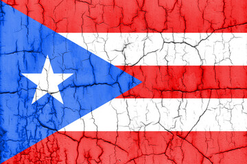 Flag of Puerto Rico on cracked wall, textured background.