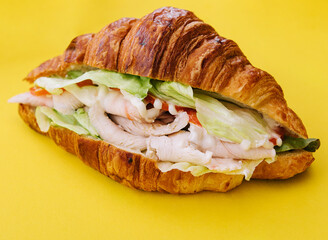 croissant sandwich ham on yellow background
