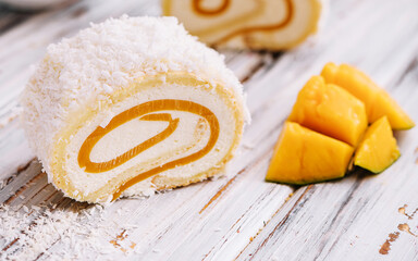 Obraz na płótnie Canvas Mango fruit cake with tea for gourmet dessert