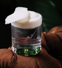 Glass filled with coconut water and foam