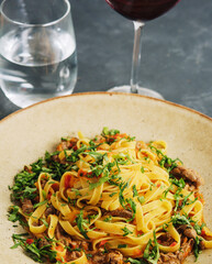 egg pasta tagliatelle with bolognese sauce made from meat and tomato sauce