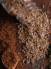 Different types of grains and seeds on shabby wooden