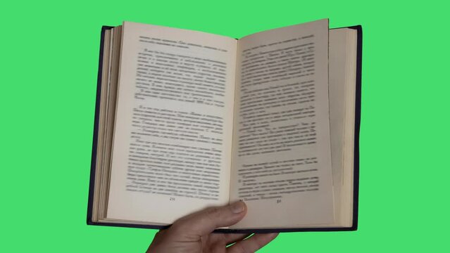 Animation of books in a hand on green background