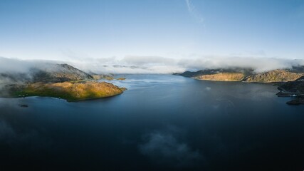 Fototapeta premium Aerial shot of an ocean with mountains in Nothern Norway