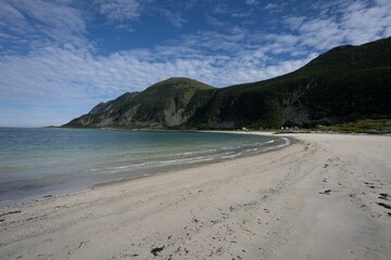 Beautiful coastline with green cliffs in the background