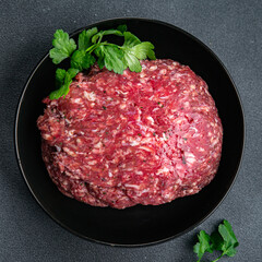 raw beef minced meat ground meat fresh ready to cook meal food snack on the table copy space food background rustic top view