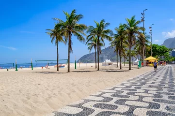 Zelfklevend Fotobehang Ipanema beach with mosaic of sidewalk in Rio de Janeiro, Brazil. Ipanema beach is the most famous beach of Rio de Janeiro, Brazil. Cityscape of Rio de Janeiro. © Ekaterina Belova