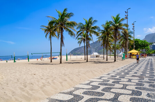 Ipanema beach with mosaic of sidewalk in Rio de Janeiro, Brazil. Ipanema beach is the most famous beach of Rio de Janeiro, Brazil. Cityscape of Rio de Janeiro.