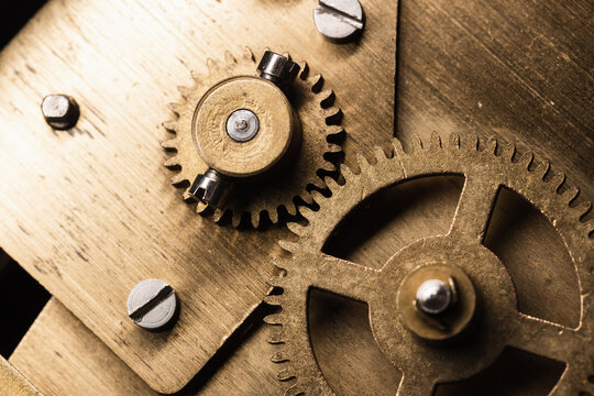 Gear made of brass, vintage clock mechanism close up photo