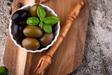 Bowl with Greek green and black olives