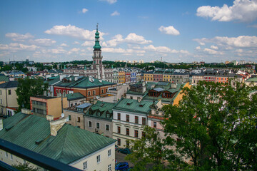 Naklejka premium Clock tower of town hall over roofs