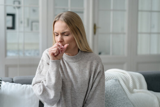 sick female coughing and has viral infection