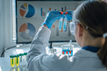 Medical research laboratory. A scientist works with a pipette and a test tube. Scientific...