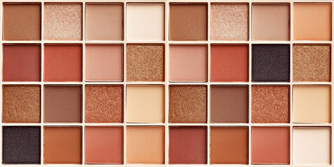 Eyeshadows palette as close up texture background, wide banner. Beauty product cosmetic powder for...