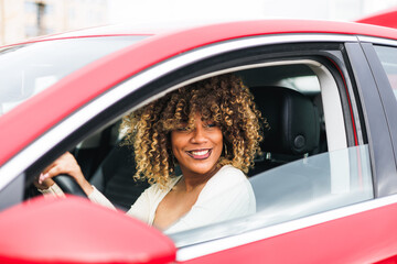 Confident Afro-Dominican Girl in red car, smiling face