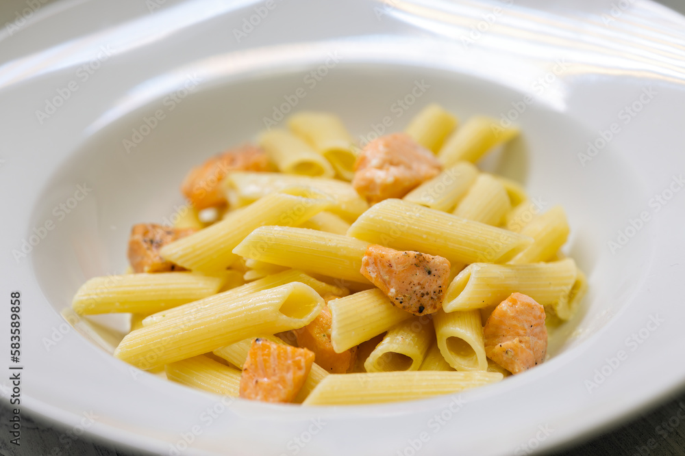 Wall mural pasta penne with salmon and lemon sauce