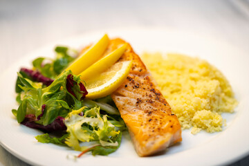 salmon fillet with couscous and vegetables salad