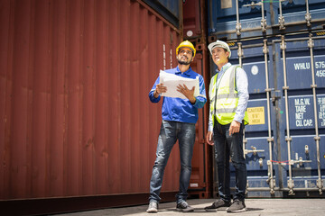 Obraz na płótnie Canvas Engineer manager and foreman control or check inventory details of containers box, worker checking quantity of product in containers.
