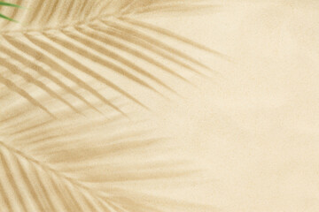 Fototapeta na wymiar Beach sand with shadow of palm leaves background
