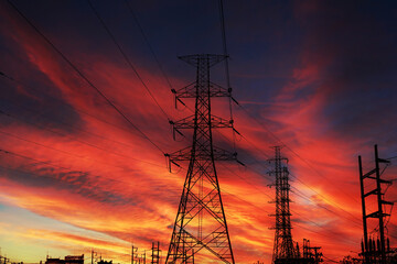 Silhouette High voltage electric tower on sunset time.