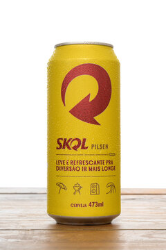 S&atilde;o Paulo, Brazil - March 18, 2023, Skol "Pilsen" beer can 473ml on a wooden board