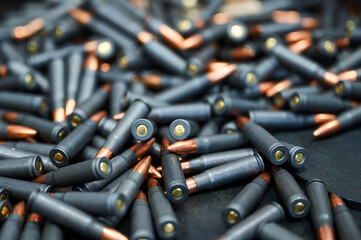 Scattered service cartridges on table at military plant