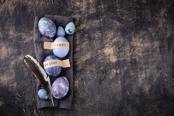 Obraz na płótnie Canvas Festive Easter eggs in purple and blue color