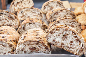 Sliced loaves bread with raisins close up, street food. Organic food