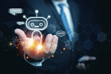 Businessman holding virtual AI chatbot communicate and answer a question on hand. Artificial Intelligence powered system. Technology conversation interface to assist users in making the best decision.