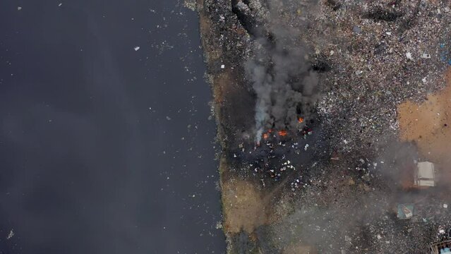 Burning of waste at waste dump near slum area in Africa 5