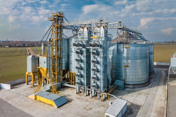 aerial view of agro-industrial complex with silos and grain drying line