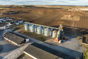 aerial view of agro-industrial complex with silos and grain drying line