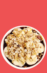Bowl full of acai (acai), banana bars, granola and etc on blank background. Ready  Template